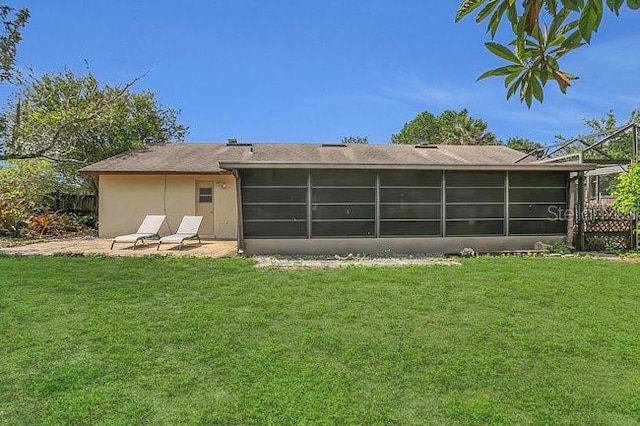 9319 Woodbreeze Blvd, Windermere, FL 34786 - rear view of property with a sunroom and stucco siding
