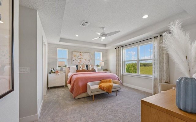2583 Long Pine Ave, Apopka, FL 32712 - bedroom featuring carpet floors, a textured ceiling, a tray ceiling, ceiling fan, and recessed lighting