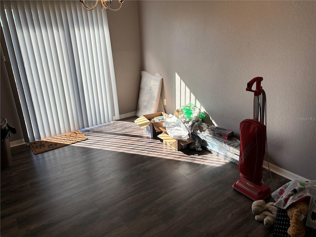 7047 SW 131st Loop, Ocala, FL 34473 - dining room featuring wood finished floors, baseboards, a textured wall, and a chandelier