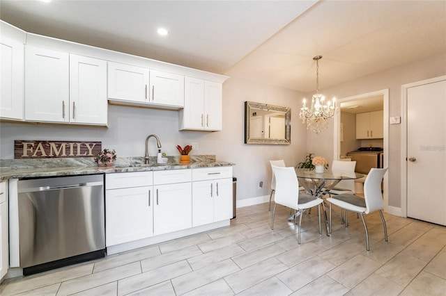 5287 Cypress Ct Unit 724, Orlando, FL 32811 - kitchen featuring stainless steel dishwasher, washer / dryer, a chandelier, white cabinetry, and light stone countertops