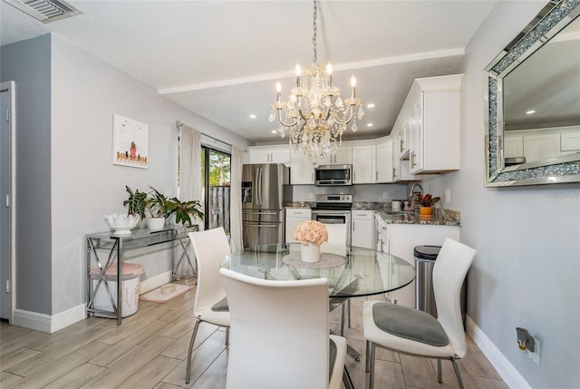5287 Cypress Ct Unit 724, Orlando, FL 32811 - dining area with wood tiled floors, a chandelier, and recessed lighting
