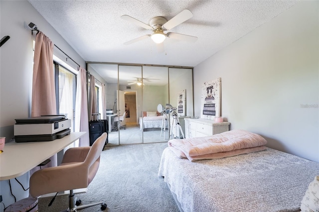 5287 Cypress Ct Unit 724, Orlando, FL 32811 - bedroom featuring carpet flooring, a textured ceiling, ceiling fan, and an office area