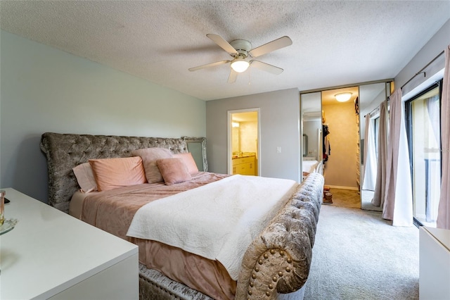 5287 Cypress Ct Unit 724, Orlando, FL 32811 - bedroom with light colored carpet, a textured ceiling, ensuite bathroom, and ceiling fan