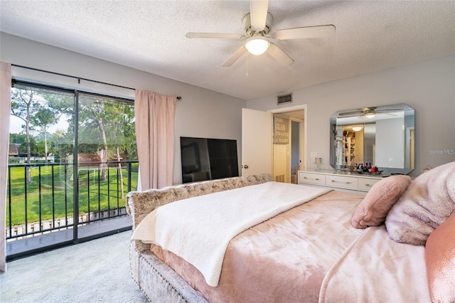 5287 Cypress Ct Unit 724, Orlando, FL 32811 - bedroom with access to outside, light colored carpet, a textured ceiling, and a ceiling fan