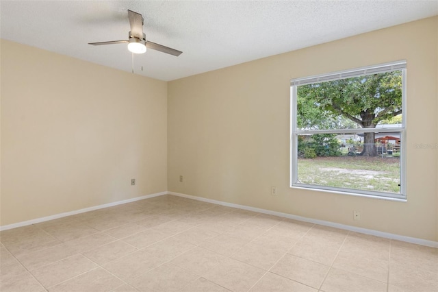 325 Little Aspen Ct, Ocoee, FL 34761 - empty room featuring ceiling fan, light tile patterned flooring, and a textured ceiling