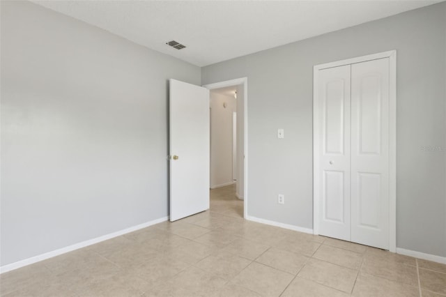 325 Little Aspen Ct, Ocoee, FL 34761 - unfurnished bedroom featuring a closet and light tile patterned floors