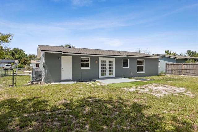 325 Little Aspen Ct, Ocoee, FL 34761 - rear view of house with french doors, a gate, a fenced backyard, and a patio area