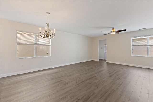 15229 Evergreen Oak Loop, Winter Garden, FL 34787 - unfurnished room featuring a chandelier, wood finished floors, ceiling fan, and baseboards