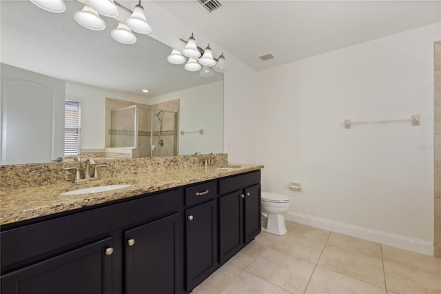 15229 Evergreen Oak Loop, Winter Garden, FL 34787 - full bathroom featuring a shower stall, double vanity, tile patterned flooring, toilet, and baseboards