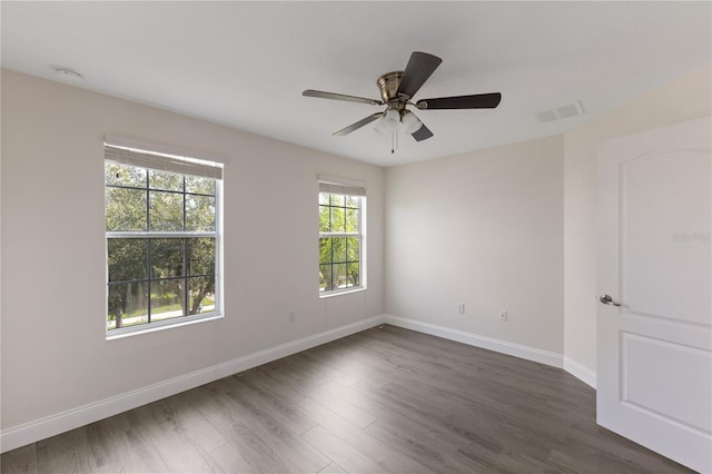 15229 Evergreen Oak Loop, Winter Garden, FL 34787 - empty room with baseboards, dark wood-style floors, a ceiling fan, and a smoke detector