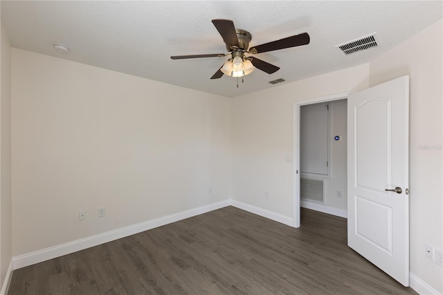 15229 Evergreen Oak Loop, Winter Garden, FL 34787 - unfurnished room with dark wood-style floors, baseboards, a ceiling fan, and a smoke detector