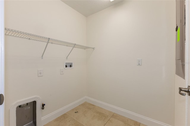 15229 Evergreen Oak Loop, Winter Garden, FL 34787 - washroom with washer hookup, baseboards, and light tile patterned flooring