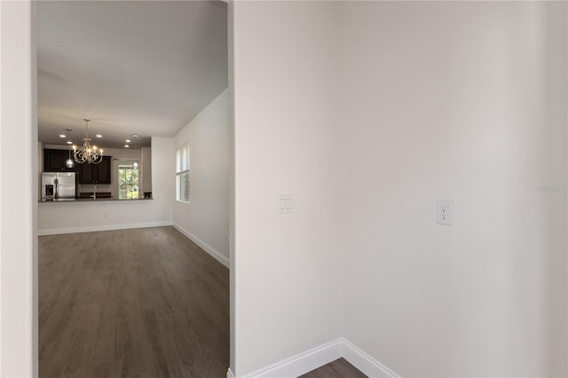 15229 Evergreen Oak Loop, Winter Garden, FL 34787 - hall with dark wood-style floors, a chandelier, baseboards, a sink, and recessed lighting