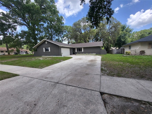 4883 Cherokee Rose Dr, Orlando, FL 32808 - single story home featuring concrete driveway and an attached garage