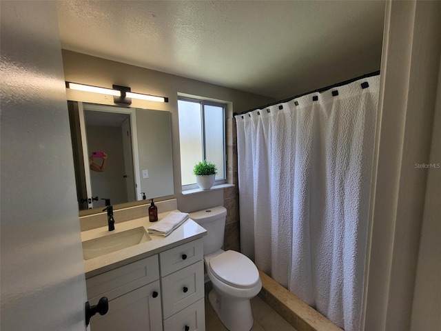 4883 Cherokee Rose Dr, Orlando, FL 32808 - bathroom featuring toilet, vanity, tile patterned floors, a shower with curtain, and a textured ceiling