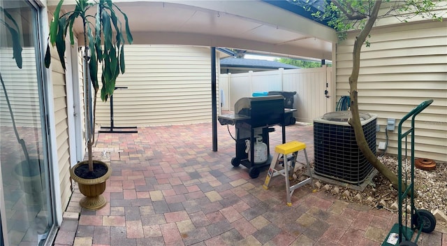 1815 Townhall Ln Unit 1815, Orlando, FL 32807 - view of patio / terrace with central AC unit and area for grilling