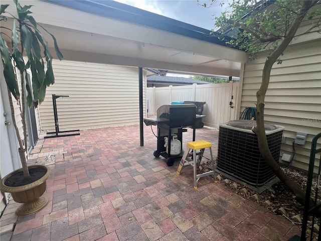1815 Townhall Ln Unit 1815, Orlando, FL 32807 - view of patio featuring central air condition unit and area for grilling