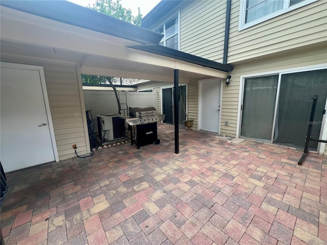 1815 Townhall Ln Unit 1815, Orlando, FL 32807 - view of patio featuring grilling area and central air condition unit
