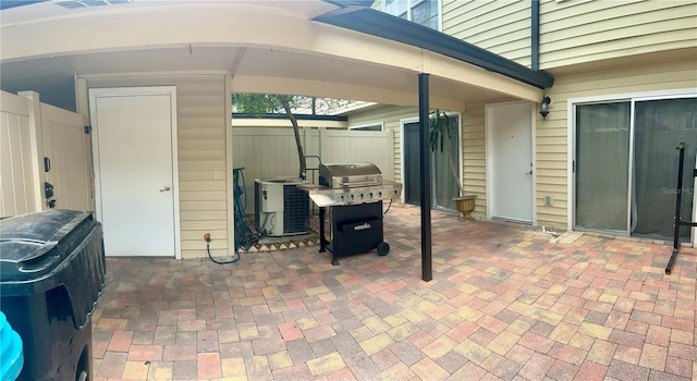 1815 Townhall Ln Unit 1815, Orlando, FL 32807 - view of patio / terrace with grilling area and cooling unit