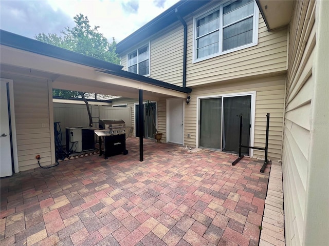 1815 Townhall Ln Unit 1815, Orlando, FL 32807 - view of patio / terrace featuring area for grilling and central air condition unit