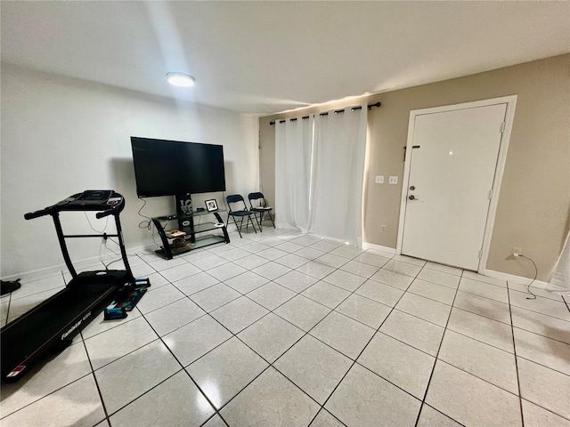 1815 Townhall Ln Unit 1815, Orlando, FL 32807 - living room featuring light tile patterned floors and baseboards