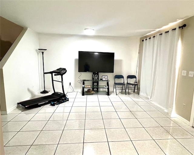 1815 Townhall Ln Unit 1815, Orlando, FL 32807 - exercise area featuring baseboards and light tile patterned floors
