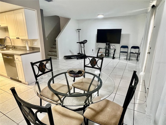1815 Townhall Ln Unit 1815, Orlando, FL 32807 - dining space with light tile patterned floors and stairway