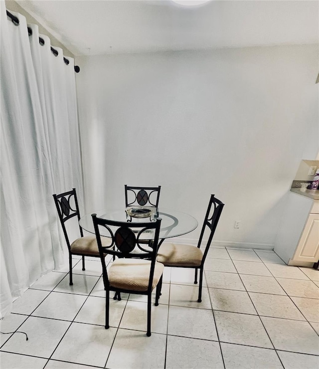 1815 Townhall Ln Unit 1815, Orlando, FL 32807 - dining room with light tile patterned floors