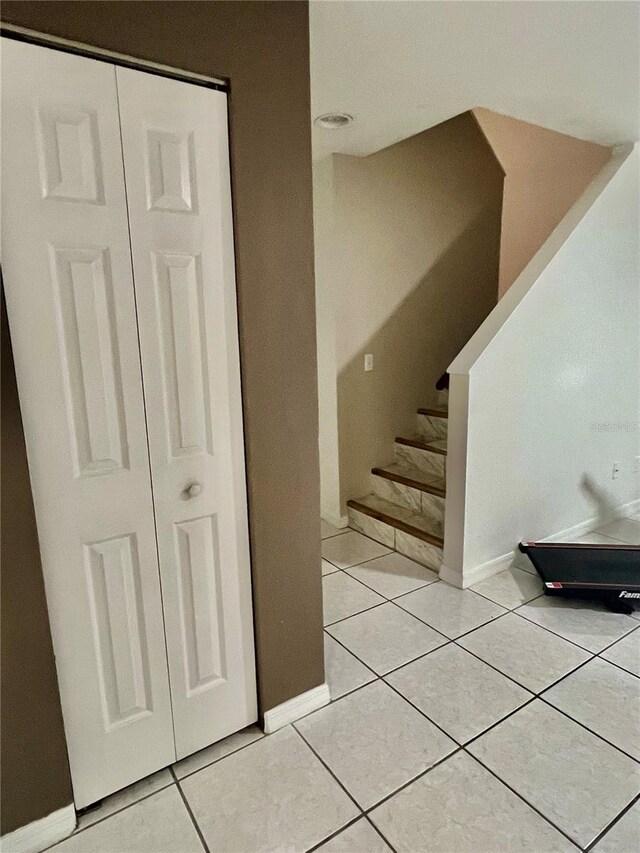 1815 Townhall Ln Unit 1815, Orlando, FL 32807 - stairway featuring baseboards and tile patterned floors