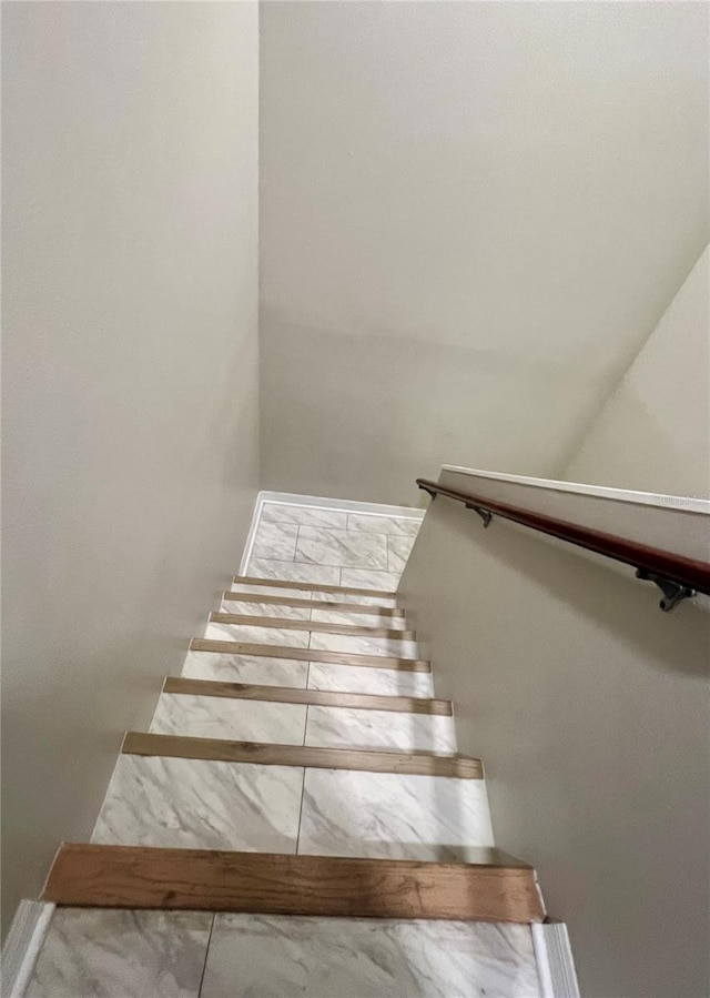 1815 Townhall Ln Unit 1815, Orlando, FL 32807 - stairway with baseboards and marble look tiles