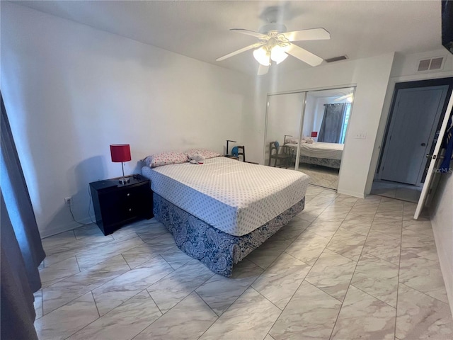 1815 Townhall Ln Unit 1815, Orlando, FL 32807 - bedroom featuring light marble finish flooring, a closet, and a ceiling fan