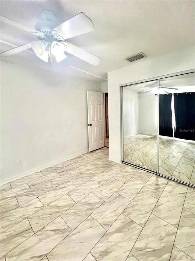 1815 Townhall Ln Unit 1815, Orlando, FL 32807 - unfurnished bedroom featuring a closet, a ceiling fan, and baseboards