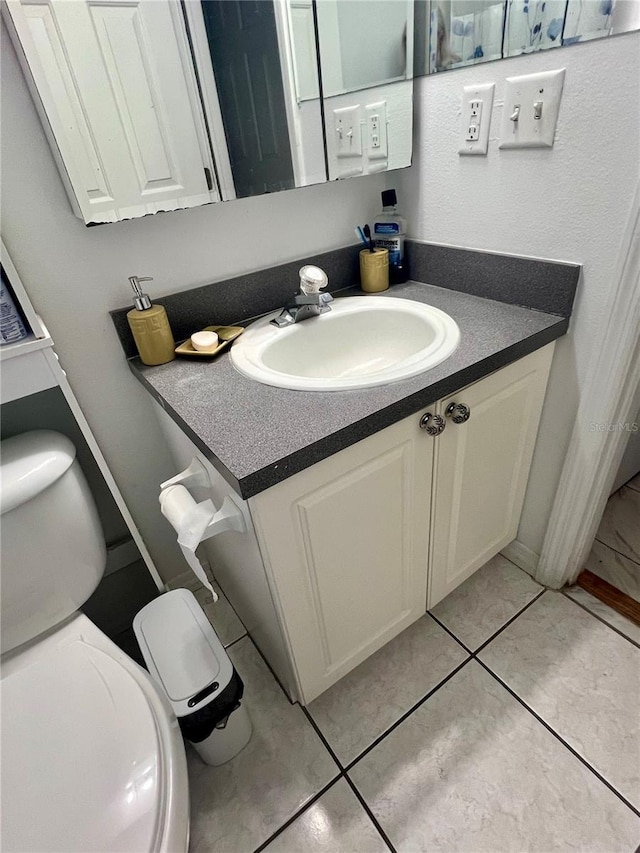 1815 Townhall Ln Unit 1815, Orlando, FL 32807 - bathroom featuring toilet, vanity, and tile patterned flooring