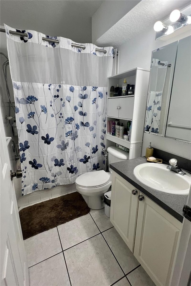 1815 Townhall Ln Unit 1815, Orlando, FL 32807 - bathroom with toilet, vanity, tile patterned floors, and shower / bath combination with curtain