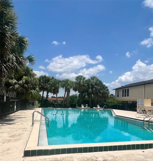 1815 Townhall Ln Unit 1815, Orlando, FL 32807 - community pool featuring a patio