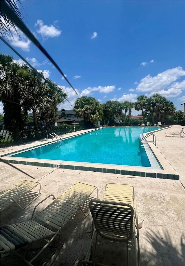1815 Townhall Ln Unit 1815, Orlando, FL 32807 - community pool with a patio