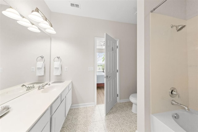 8024 Cool Breeze Dr Unit 132, Orlando, FL 32819 - bathroom with toilet, shower / tub combination, double vanity, ensuite bath, and baseboards