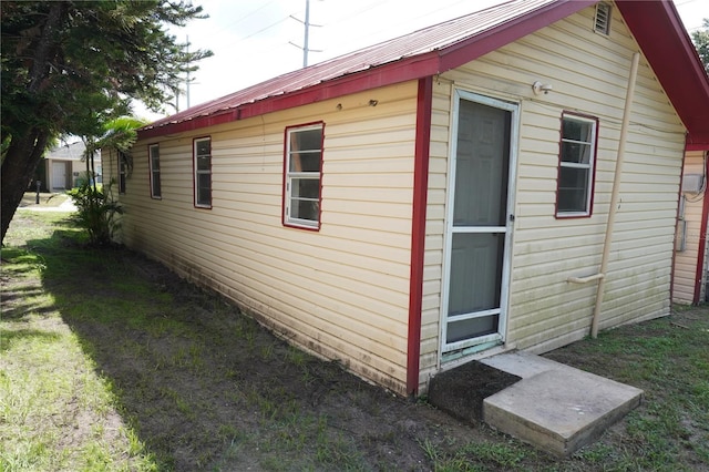 622 Booker, Lake Wales, FL 33853 - view of property exterior featuring metal roof