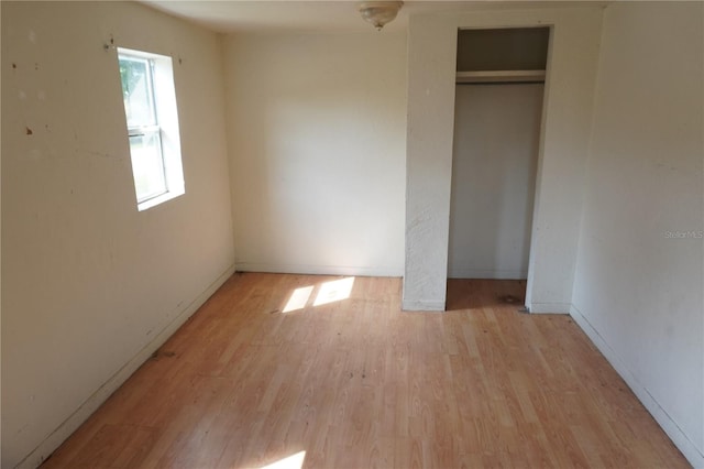 622 Booker, Lake Wales, FL 33853 - unfurnished bedroom featuring light wood finished floors and a closet