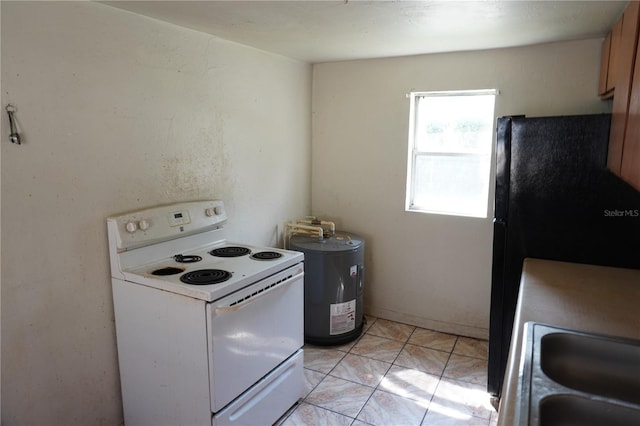 622 Booker, Lake Wales, FL 33853 - kitchen featuring white range with electric cooktop, freestanding refrigerator, a sink, and light marble finish floors