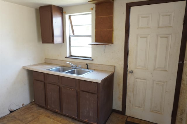 622 Booker, Lake Wales, FL 33853 - kitchen featuring a sink, light countertops, and open shelves