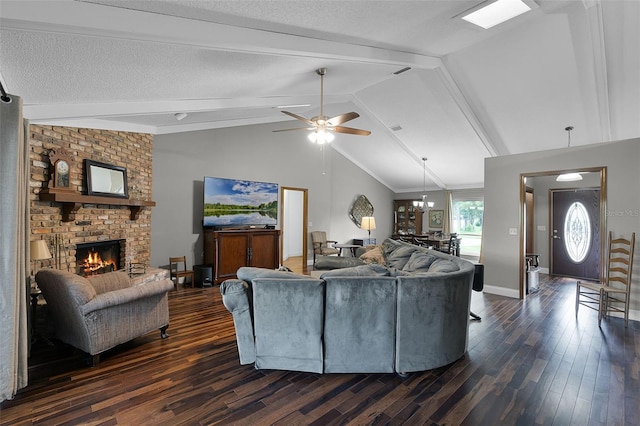 526 Sabal Trail Cir, Longwood, FL 32779 - living room featuring dark wood-style floors, a fireplace, a ceiling fan, and a chandelier