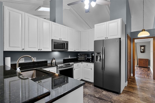 526 Sabal Trail Cir, Longwood, FL 32779 - kitchen featuring appliances with stainless steel finishes, vaulted ceiling, ceiling fan, white cabinets, and dark stone countertops
