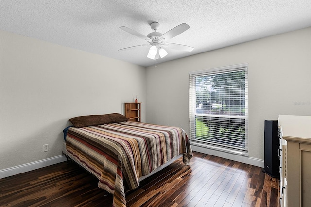 526 Sabal Trail Cir, Longwood, FL 32779 - bedroom featuring dark wood-style flooring, a textured ceiling, and a ceiling fan