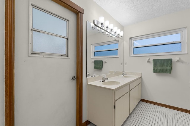 526 Sabal Trail Cir, Longwood, FL 32779 - bathroom featuring double vanity, a textured ceiling, and tile patterned flooring