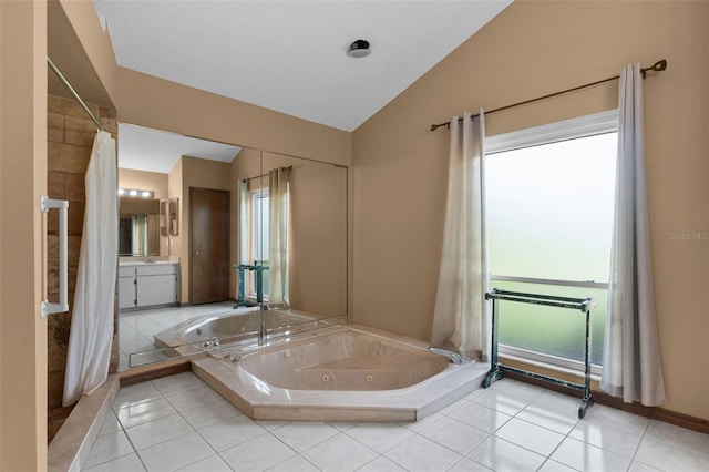 526 Sabal Trail Cir, Longwood, FL 32779 - full bathroom with vaulted ceiling, a tub with jets, vanity, and tile patterned floors