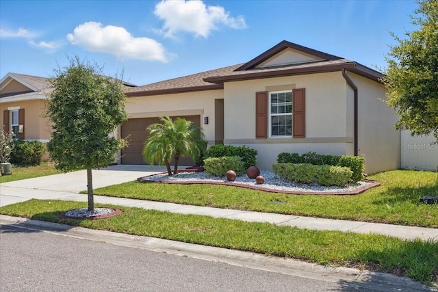 914 Fallon Hills Dr, Haines City, FL 33844 - ranch-style house featuring a garage, stucco siding, and concrete driveway