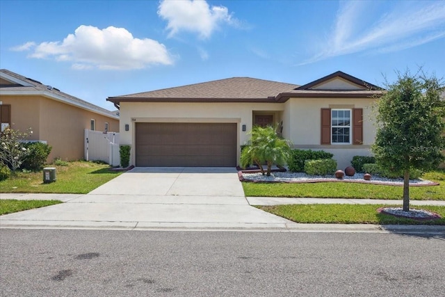 914 Fallon Hills Dr, Haines City, FL 33844 - single story home with a garage, concrete driveway, stucco siding, and a front yard