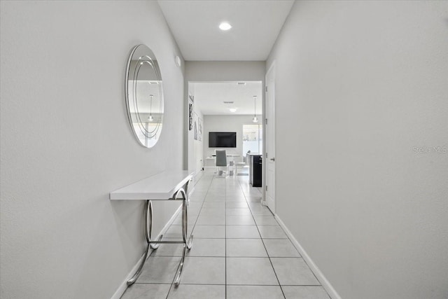 914 Fallon Hills Dr, Haines City, FL 33844 - hallway featuring baseboards and light tile patterned flooring