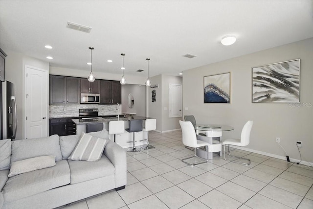 914 Fallon Hills Dr, Haines City, FL 33844 - living area with baseboards, recessed lighting, and light tile patterned floors